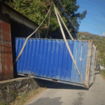 Livrer un conteneur 20 pieds d'occasion à l'intérieur d'un bâtiment en Rhône-Alpes